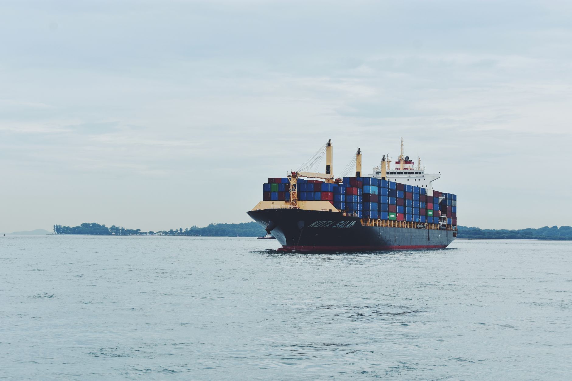 Cargo container ship at sea laden with freight
